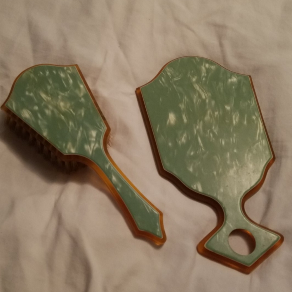 Antique hand mirror and brush